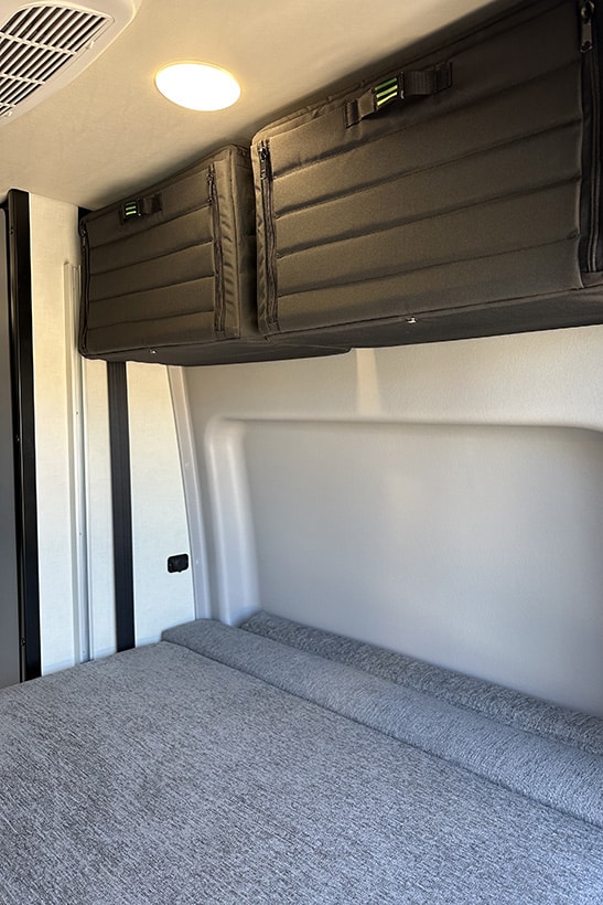 sprinter cabinets in revel van bunk area, van storage, tourig storage units, adventure vans, overland vans